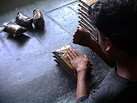 Packing coffee by hand